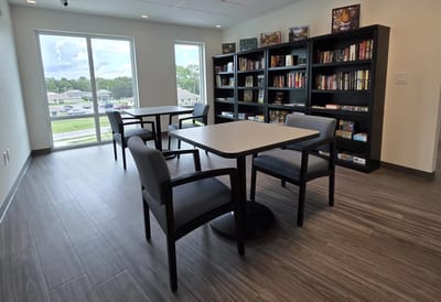 Common area with seating and bookshelves