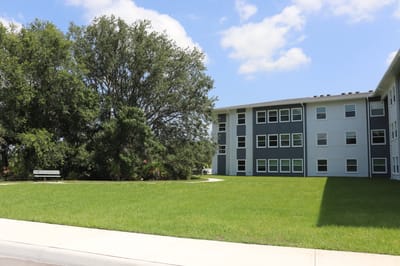 Exterior view of a building with surrounding greenery.