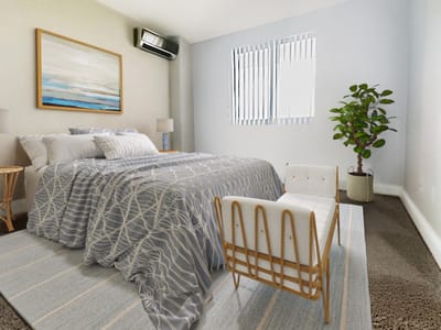 Cozy bedroom setup with a plant and artwork