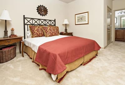 Cozy bedroom setup with a bed and decor.