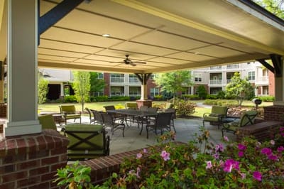Outdoor seating area with tables and flowers