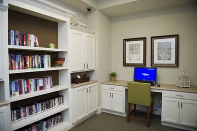 Cozy interior space with bookshelves and a computer
