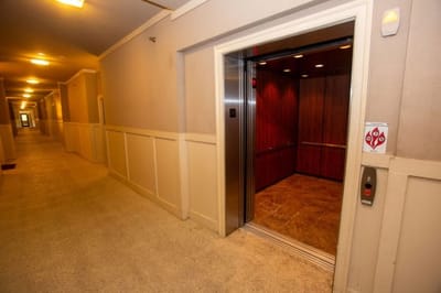 Elevator entrance in a long corridor