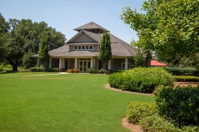Exterior view of a facility surrounded by greenery.