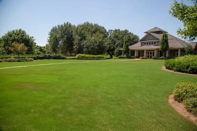 Well-maintained green lawn in front of facility