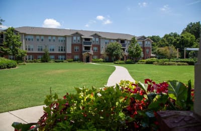 Exterior view of the facility with landscaped grounds
