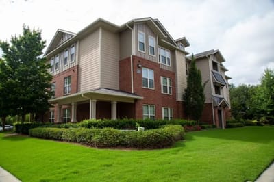 Exterior view of the facility with landscaped grounds.