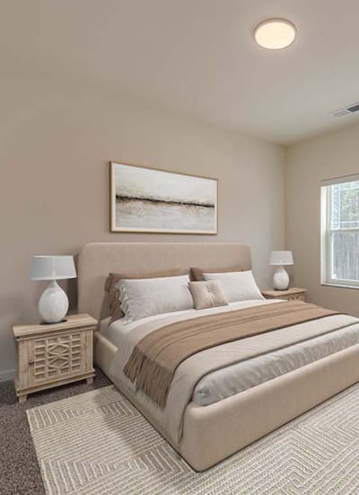 Cozy bedroom with neutral tones and modern decor.