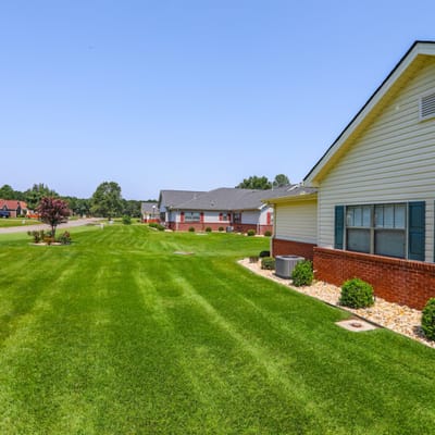 Well-maintained lawn with residential buildings