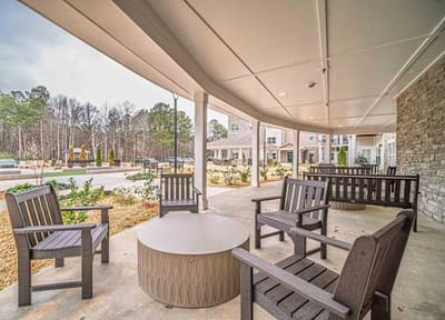 Outdoor seating area with chairs and tables.