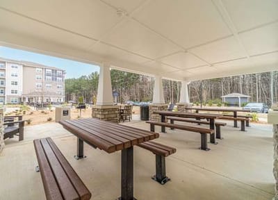 Covered outdoor seating area with tables