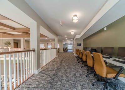 Interior hallway with computer stations and seating