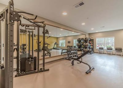 Well-equipped fitness room with exercise machines.