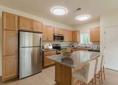 Modern kitchen with wooden cabinets and appliances