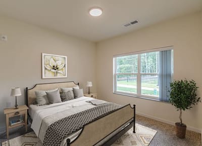 Cozy bedroom with natural light and plants