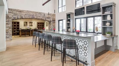 Spacious common area with a bar and seating