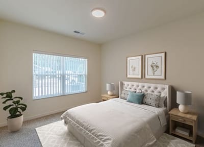Well-furnished resident bedroom with natural light.