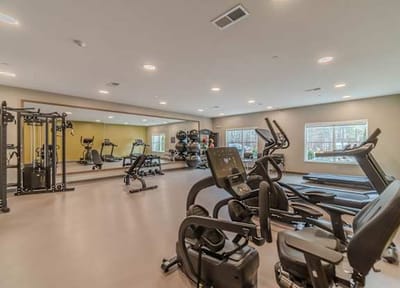 Interior view of a fitness room with exercise equipment.