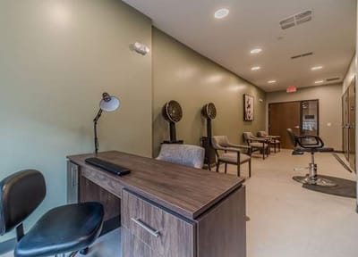 Interior hallway with seating and salon chairs.