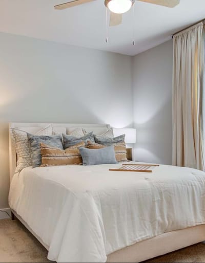 Well-decorated bedroom with soft bedding