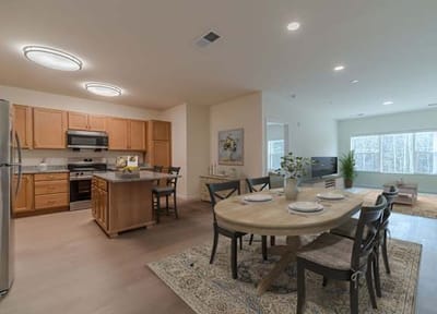 Modern kitchen and dining area with natural lighting.