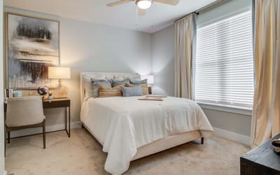 Comfortable bedroom with warm decor and natural light