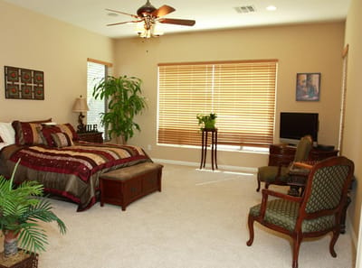 Comfortable senior living bedroom with decor.