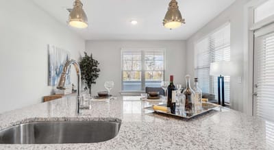 Modern kitchen with elegant decor and dining setup.