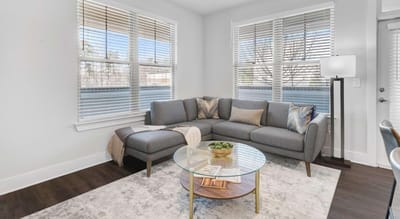 Cozy living room setup with a sofa and coffee table.