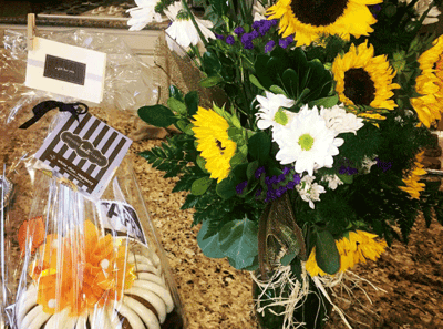 Colorful bouquet and flower arrangement on a countertop.