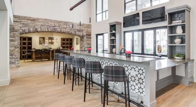 Stylish common area with modern decor and bar seating.