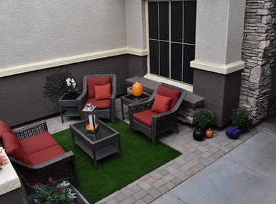 Outdoor patio area with seating and decor.
