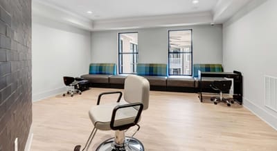 Hair salon area with chairs and seating
