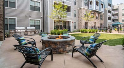 Outdoor seating area with a fire pit and chairs