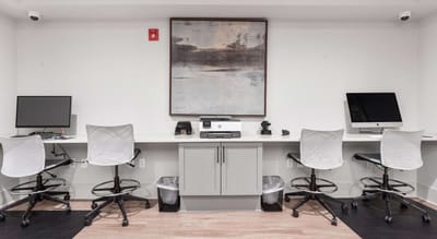 Workstations with computers in a facility interior