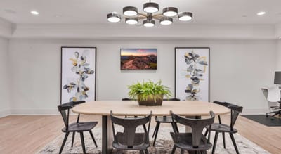 Modern dining area with plants and artwork