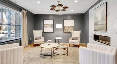 Chic common area with comfortable seating and artwork.