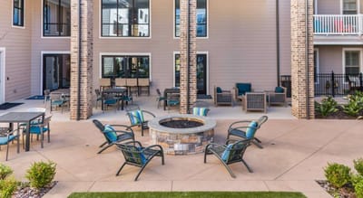 Outdoor seating area with fire pit and chairs