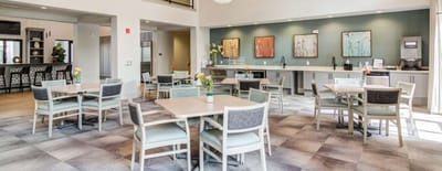 Bright dining area with tables and chairs