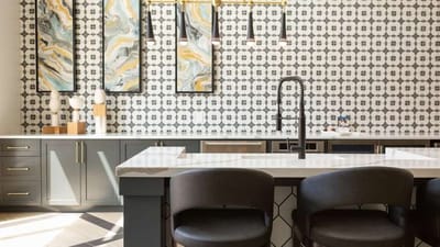 Modern kitchen in a dining area with stylish decor.