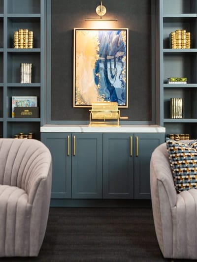 Modern lounge area with art and seating.