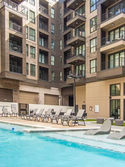 Outdoor pool area with lounge chairs
