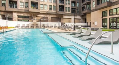 Swimming pool with loungers and umbrellas.