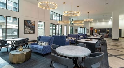 Modern common area with seating and lighting fixtures.