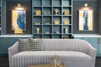 Cozy seating area with artwork and decor.