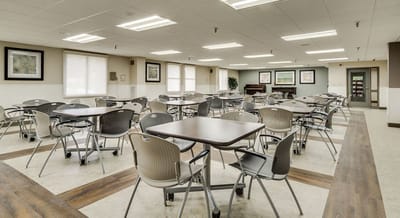Empty common area with tables and chairs