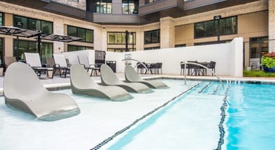 Pool area with modern lounge chairs