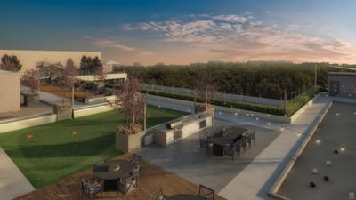 Spacious outdoor area with seating and greenery.