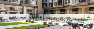 Outdoor pool area with seating and lounging spaces.