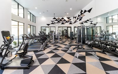 Modern fitness center with exercise equipment.